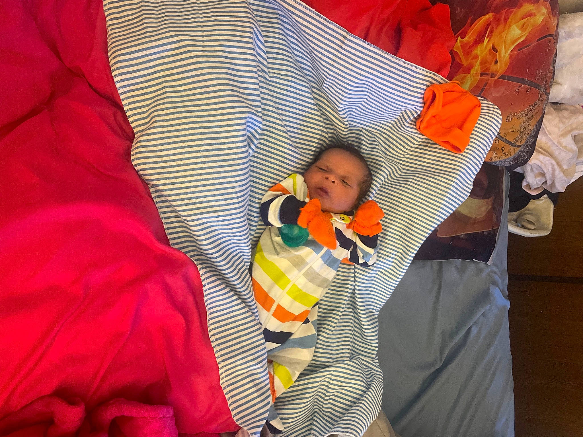 Cartier joined the competition — help win amazing prizes! baby, baby_products, baby_toddler_clothing, carmine, child, comfort, event, fun, infant_bed, linens, orange, pattern, person, room, sitting, sleeve, textile, toddler