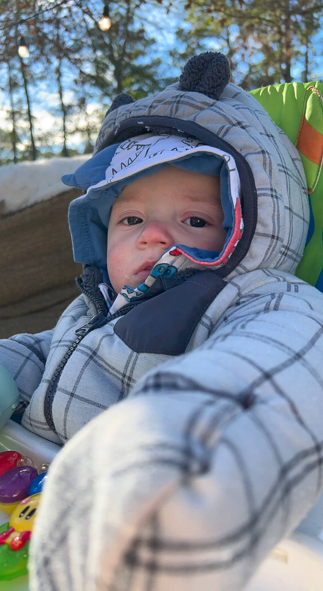 Atlas is registered to the contest to win money with this photo: baby, baby_products, baby_toddler_clothing, cheek, comfort, freezing, fun, grass, happy, headwear, knit_cap, leisure, people_in_nature, person, personal_protective_equipment, plant, recreation, sitting, snow, toddler