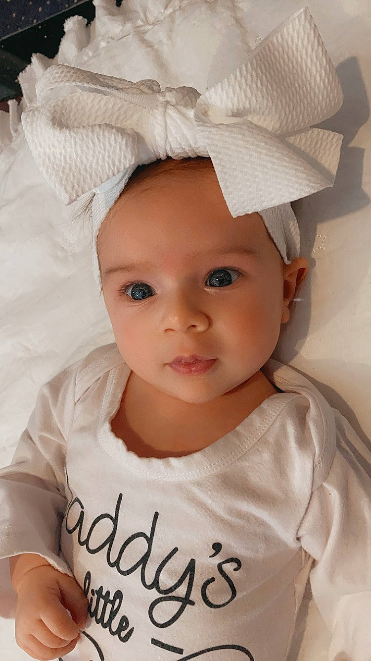 Maizie is registered to the contest to win money with this photo: baby, baby_toddler_clothing, beauty, cheek, child, chin, eyebrow, eyelash, gesture, happy, hat, iris, lip, people, person, product, skin, sleeve, textile, toddler