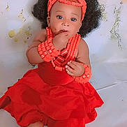 Merry participe au concours pour gagner de l'argent avec cette photo : accessories, anklet, baby, beads, bracelets, child, curly_hair, cute, feet, flower_background, hands, headband, indoor, innocent, portrait, red_dress, sitting, skin, traditional_clothing, young_child