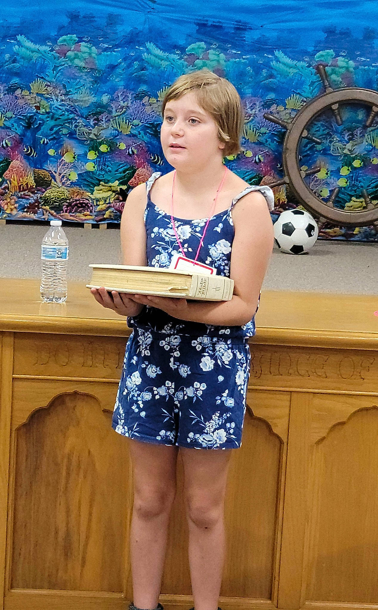 Kaylee joined the competition — help win amazing prizes! azure, blond, blue, bottle, electric_blue, event, fun, happy, human_leg, knee, leg, leisure, organ, person, photograph, plant, sitting, summer, thigh, water_bottle