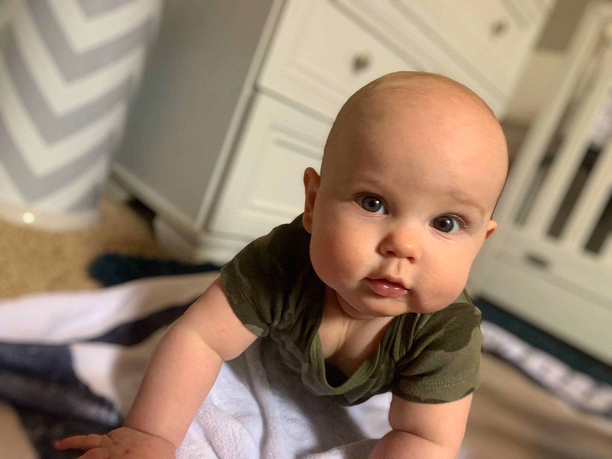 Kysen is registered to the contest to win money with this photo: baby, baby_toddler_clothing, cheek, chest, child, comfort, elbow, eyelash, floor, flooring, happy, hardwood, iris, nose, person, room, sitting, skin, sleeve, toddler