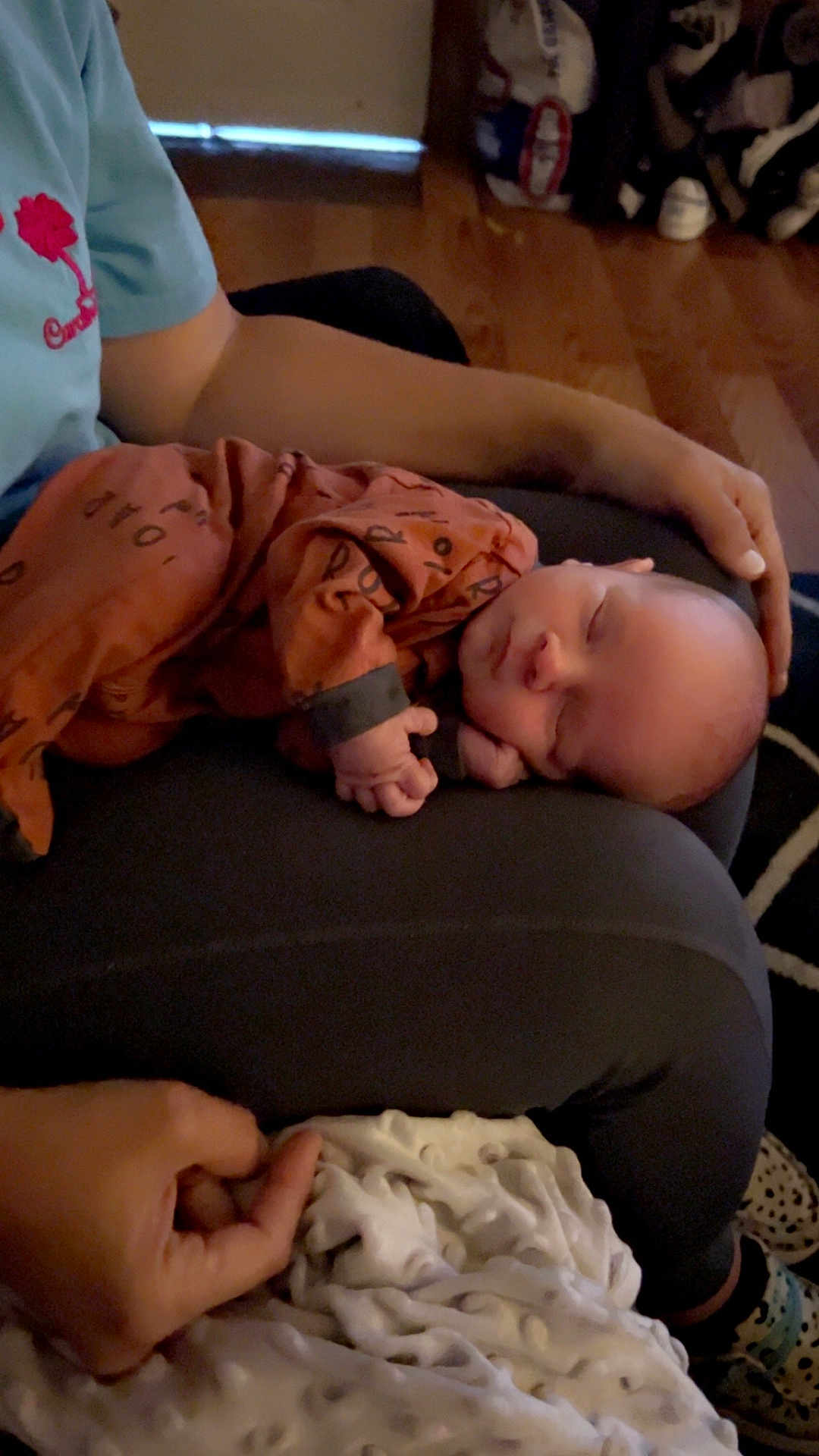 Nolan Knox is registered to the contest to win money with this photo: baby, sleeping, pajamas, hand, lap, person, indoor, cozy, peaceful, child, infant, relaxing, clothing, floor, carpet, blanket, wooden_floor, rest, comfort, toddler