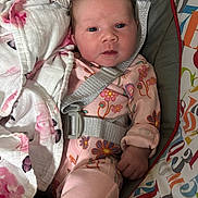 Lainey joined the competition — help win amazing prizes! baby, infant, child, onesie, blanket, baby_seat, floral_pattern, straps, colorful, cute, newborn, soft, comfortable, indoors, portrait, looking_at_camera, pink, sleepwear, toddler, face