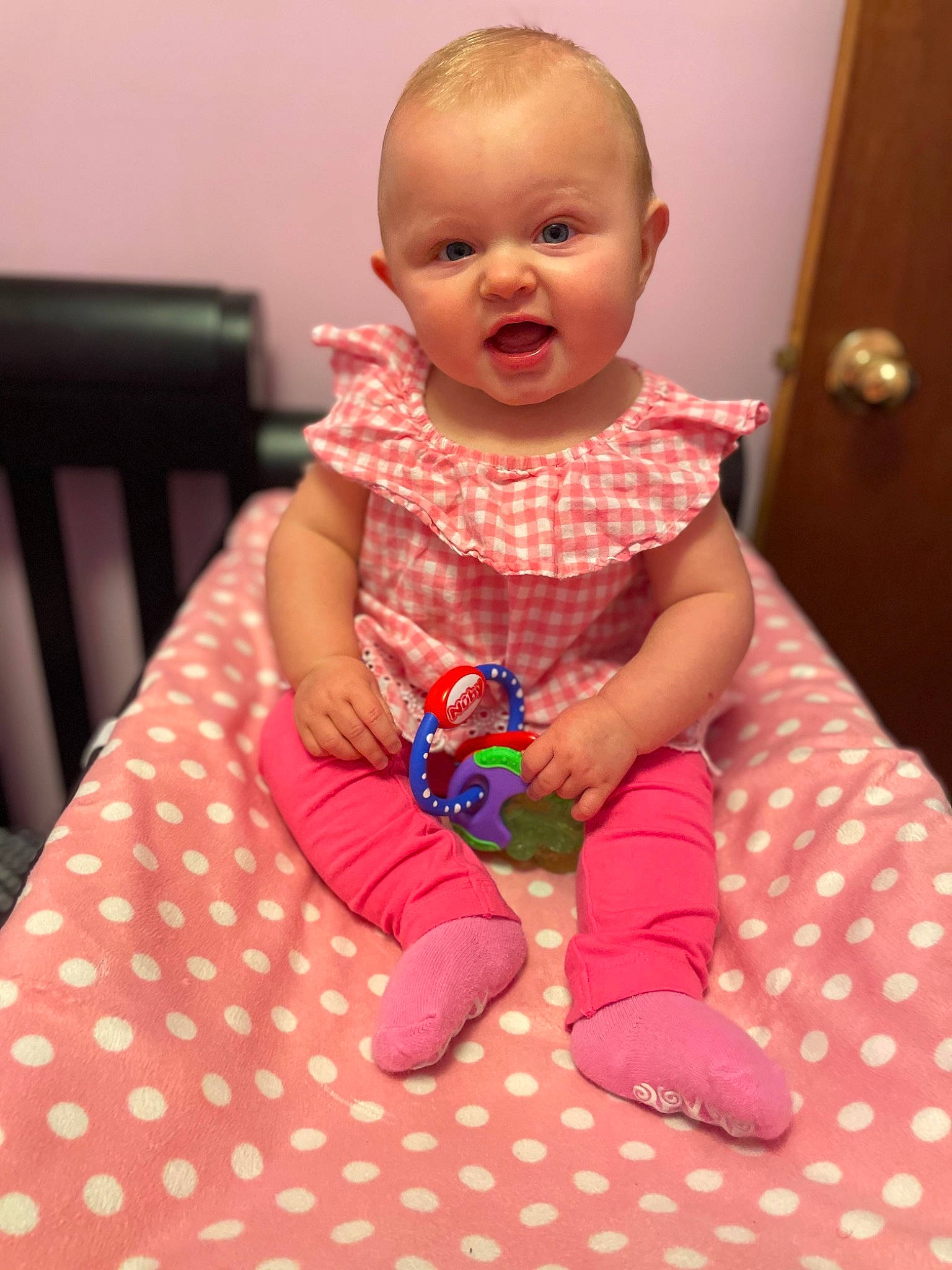 Adley joined the competition — help win amazing prizes! baby, baby_toddler_clothing, cheek, child, comfort, dress, eye, face, fun, happy, head, linens, magenta, pattern, person, pink, sitting, skin, sleeve, smile