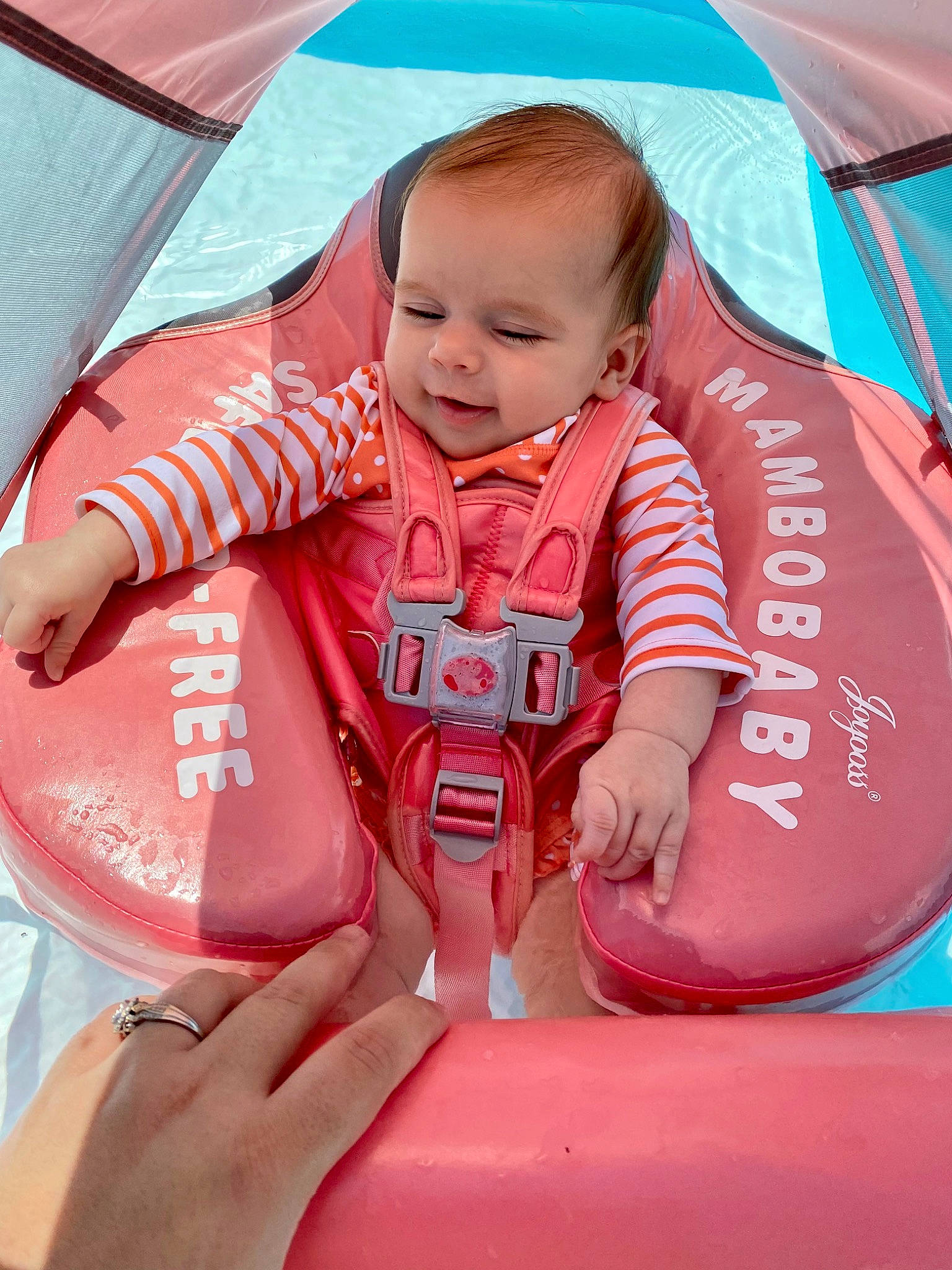 Ember joined the competition — help win amazing prizes! baby, baby_toddler_clothing, child, comfort, finger, fun, hand, happy, inflatable, lap, leisure, person, pink, recreation, red, sitting, skin, smile, tent, thumb