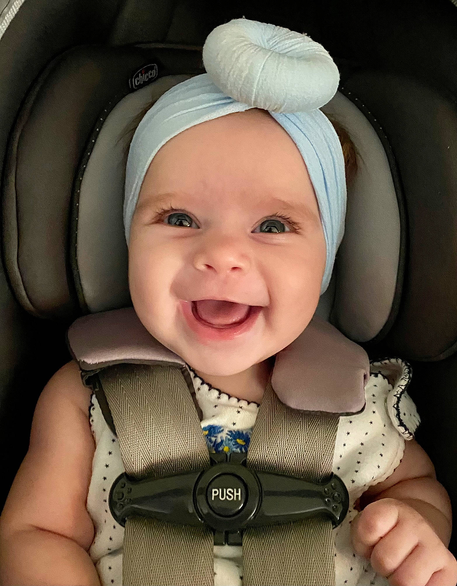 Ember is registered to the contest to win money with this photo: baby, baby_carriage, baby_in_car_seat, baby_toddler_clothing, cheek, chin, comfort, eye, eyebrow, finger, gesture, happy, head, headwear, iris, joy, outerwear, person, product, seat_belt