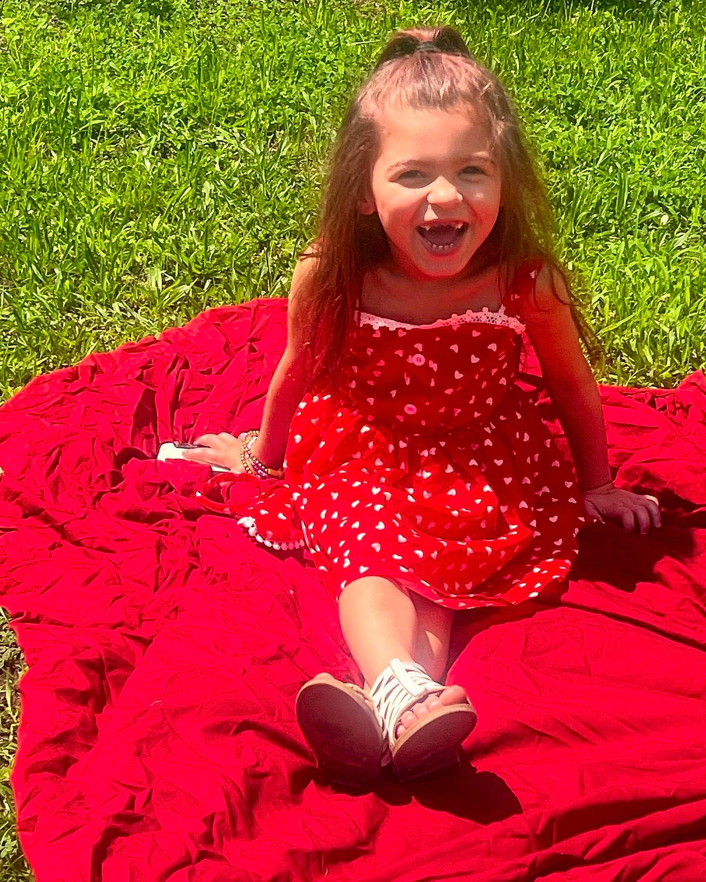 Amayrani joined the competition — help win amazing prizes! baby_toddler_clothing, child, dress, facial_expression, grass, hairstyle, happy, joy, leaf, leisure, magenta, pattern, people_in_nature, person, photograph, pink, plant, recreation, red, smile