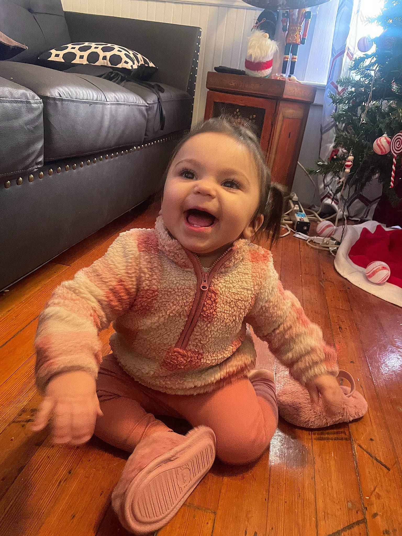 Kaycee joined the competition — help win amazing prizes! baby, baby_toddler_clothing, child, comfort, eye, floor, flooring, foot, happy, hardwood, human_leg, living_room, person, plant, sitting, smile, studio_couch, thigh, toddler, wood