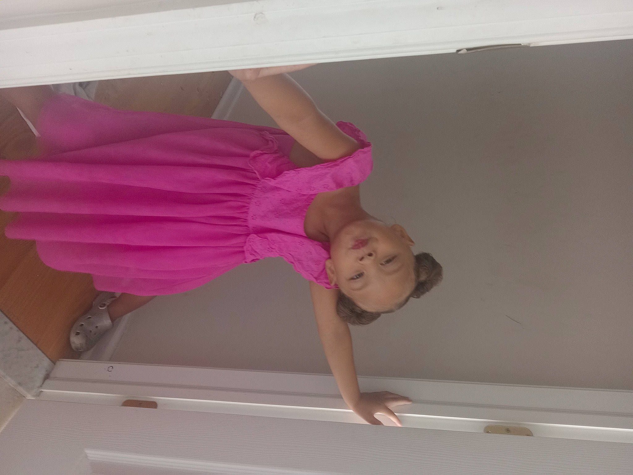 Sevyn is registered to the contest to win money with this photo: ceiling, cleanliness, comfort, elbow, flooring, fun, hardwood, human_leg, linens, magenta, molding, person, pink, plaster, room, shade, textile, thigh, toddler, waist