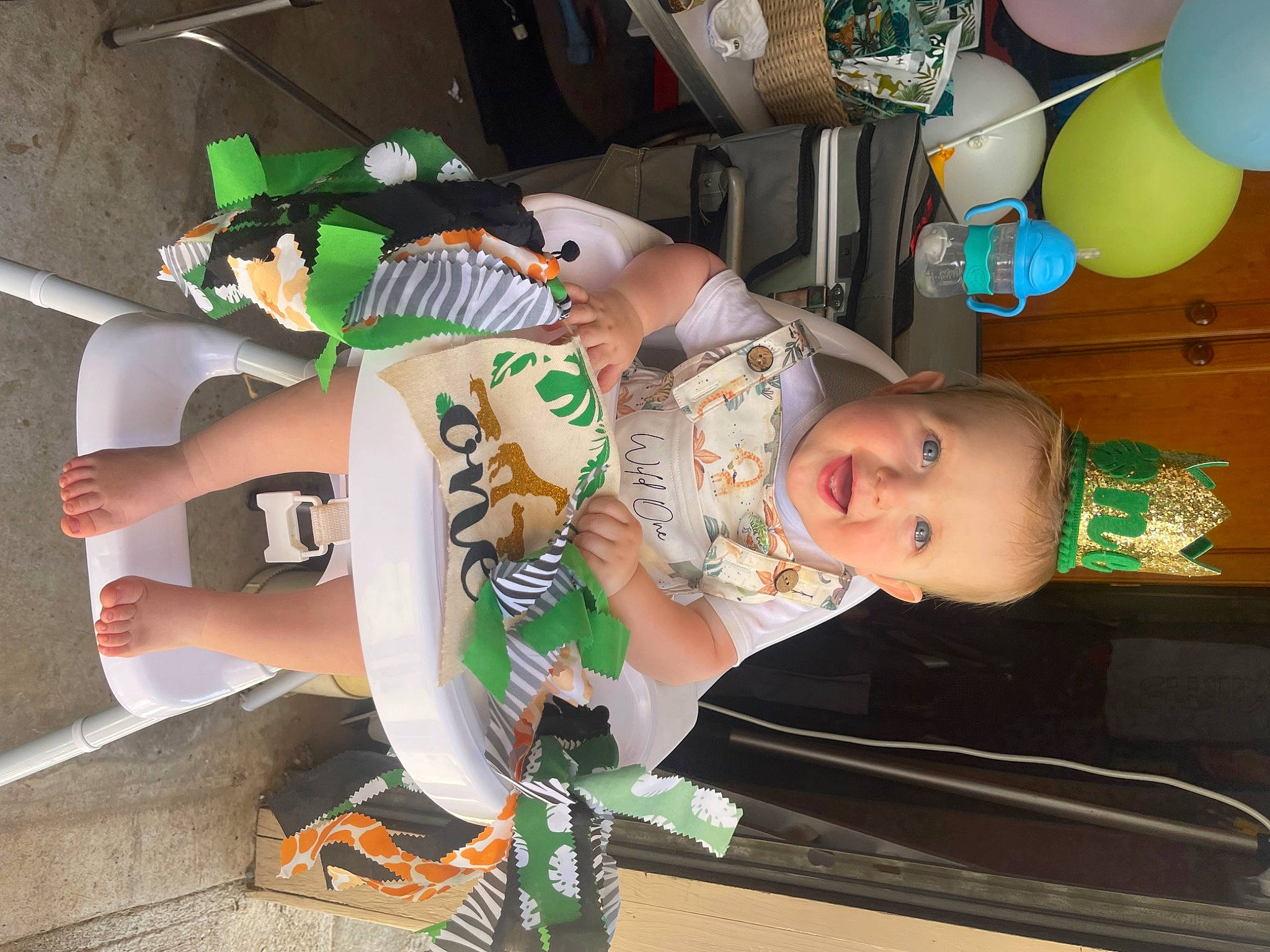 Benji joined the competition — help win amazing prizes! baby, balloon, child, elbow, fun, green, hat, human_leg, party_supply, person, t_shirt, thigh, toddler, wrist