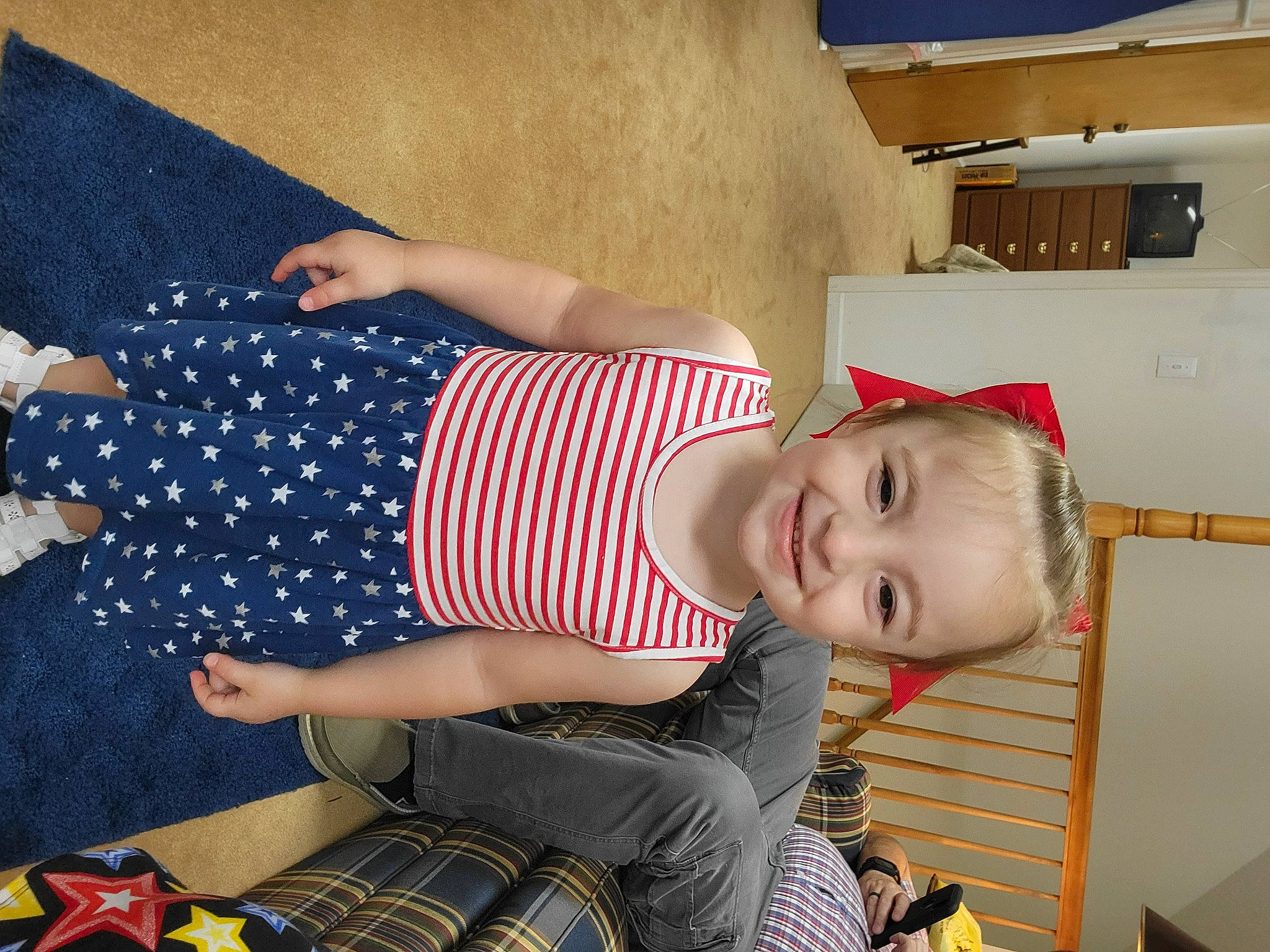 Destiny is registered to the contest to win money with this photo: arm, child, fun, happy, human_leg, joy, lap, leg, pattern, people, person, photograph, plaid, red, sitting, smile, snapshot, tartan, thigh, toddler