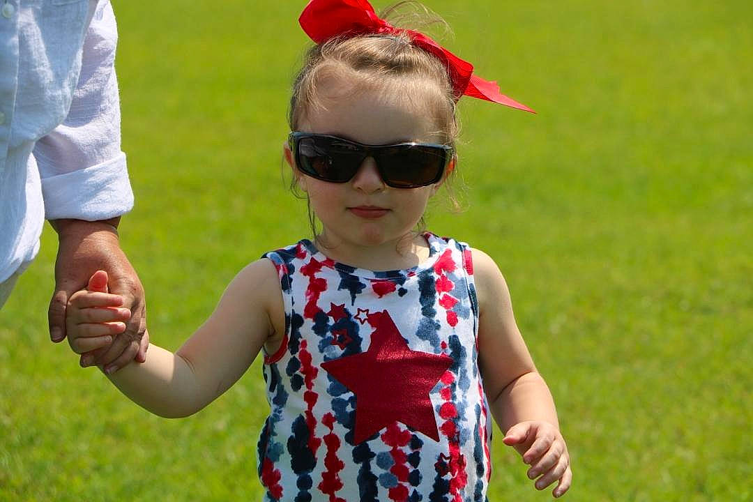 Destiny joined the competition — help win amazing prizes! baby_toddler_clothing, child, eyewear, face, gesture, glasses, goggles, grass, happy, leisure, meadow, people_in_nature, person, plant, recreation, red, sleeve, summer, sunglasses, toddler