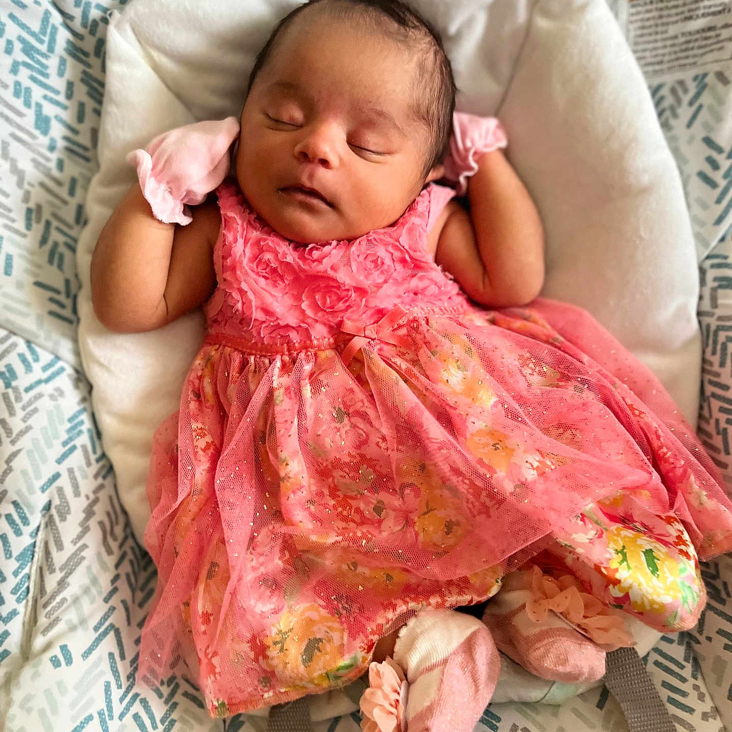 Annamarie joined the competition — help win amazing prizes! baby, baby_seat, child, comfortable, cute, fabric, floral_pattern, indoors, infant, mittens, newborn, peaceful, pink_dress, portrait, resting, sleep, sleeping, socks, soft_texture, toddler