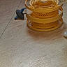animal, beige_floor, cat, cat_toy, curiosity, curious_cat, domestic_cat, feline, floor, indoor, mouse_toy, multi_tier, pet, pet_toy, plastic_toy, play, side_view, spinning_ball, toy_mouse, yellow_toy