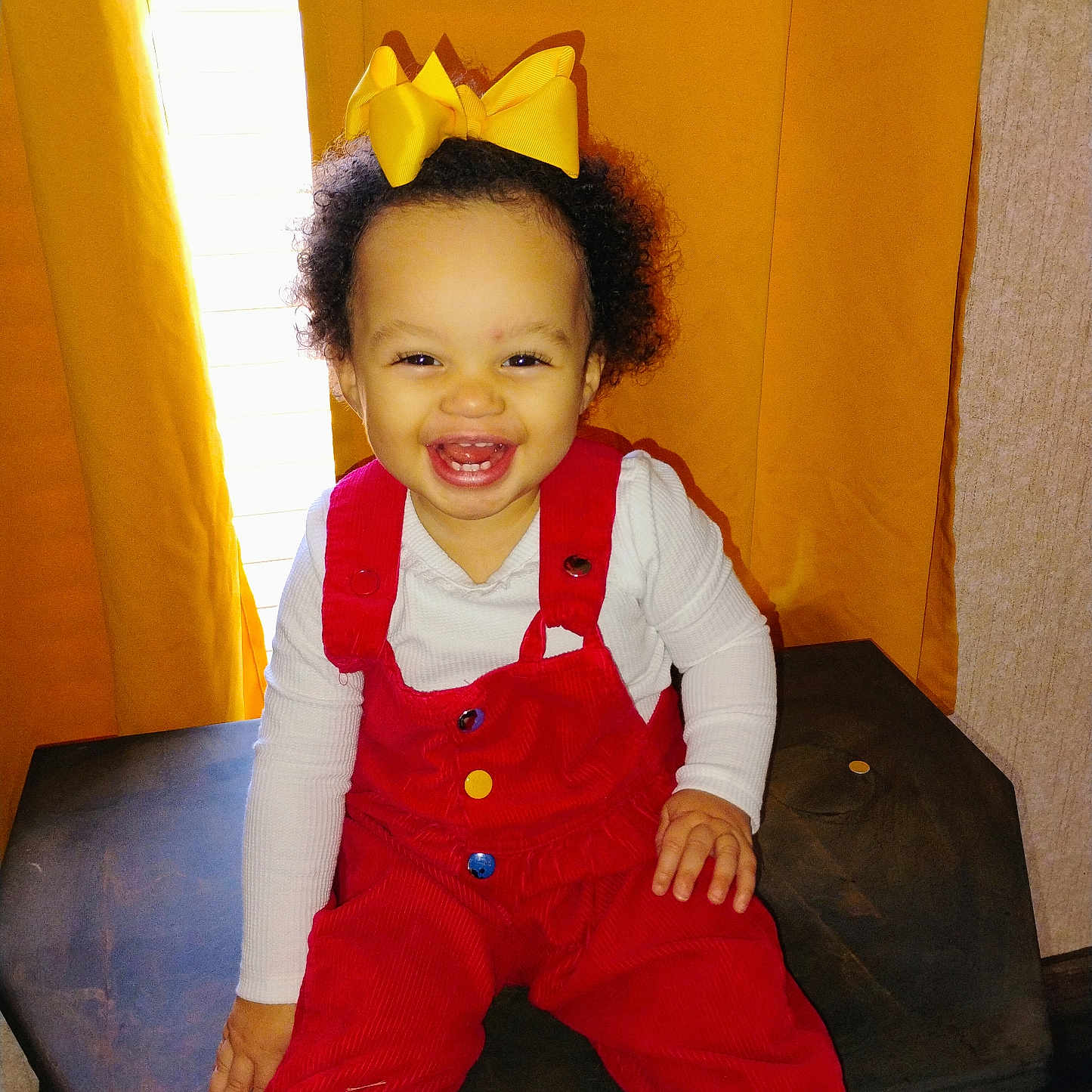 Willow joined the competition — help win amazing prizes! accessories, baby, bodypart, clothing, costume, dress, face, finger, hand, happy, hat, head, jeans, pants, person, photography, portrait, sitting, vest, wood