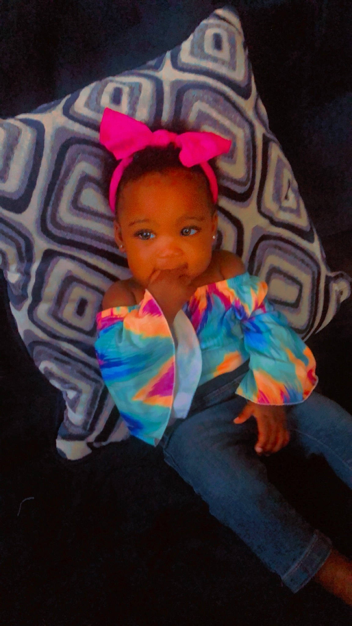 Jourdynn is registered to the contest to win money with this photo: baby_toys, beanie, cap, cheek, child, costume, doll, electric_blue, eye, fashion_accessory, figurine, fun, magenta, pattern, person, pink, plastic, play, sitting, textile