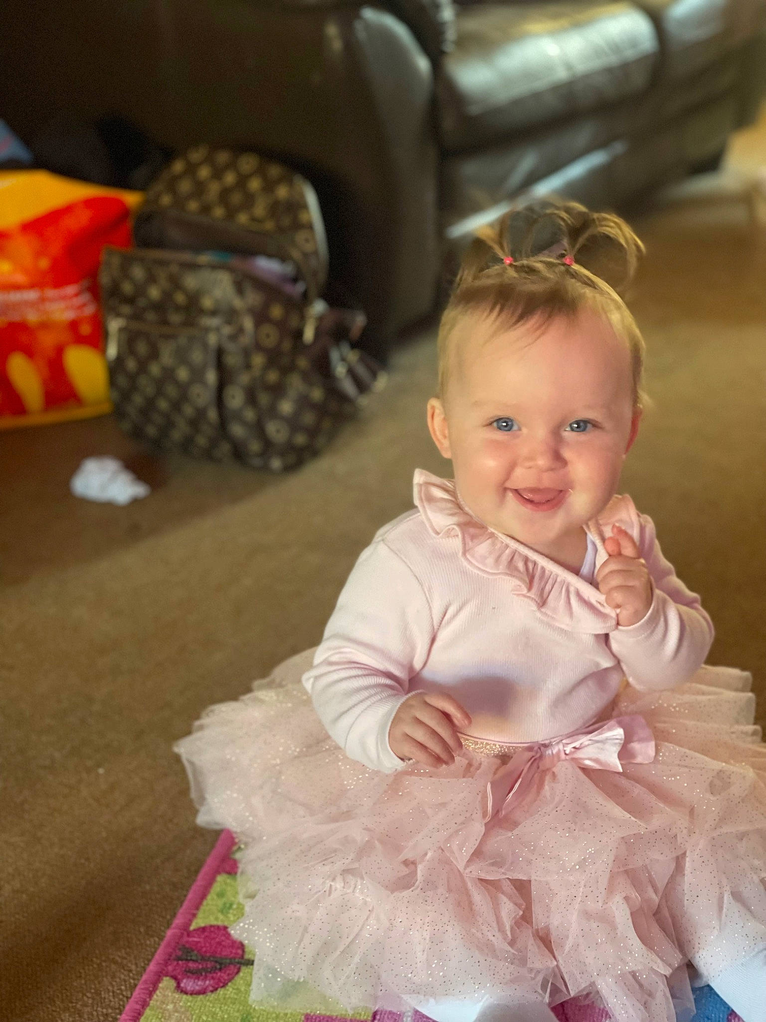Aria-rose is registered to the contest to win money with this photo: baby, baby_products, baby_toddler_clothing, child, comfort, couch, dress, event, fashion_accessory, flooring, formal_wear, fruit, fun, happy, head, headpiece, joy, magenta, person, sitting