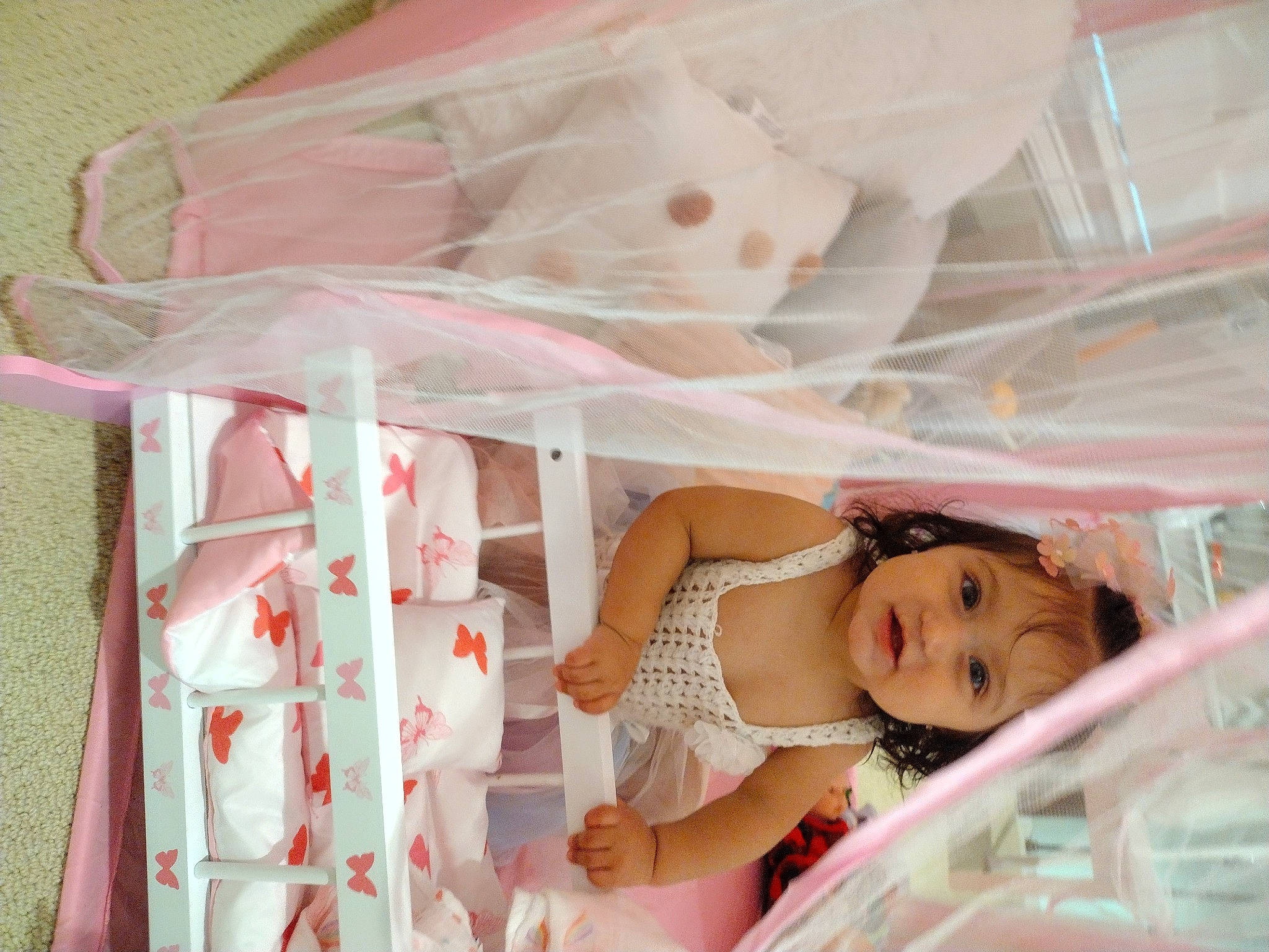 Milani is registered to the contest to win money with this photo: baby_products, bed, bed_sheet, bedding, bedroom, child, comfort, event, fun, happy, infant_bed, linens, magenta, peach, person, pink, room, smile, textile, toddler