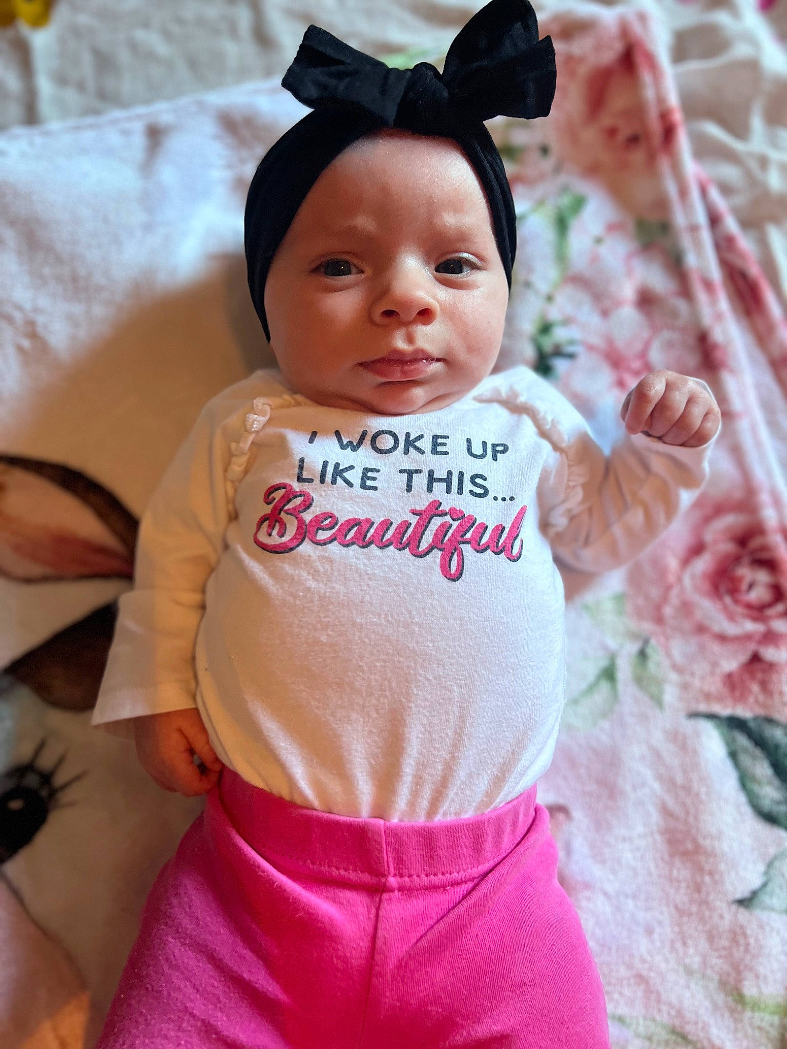 Oaklynn is registered to the contest to win money with this photo: baby, baby_toddler_clothing, cap, cheek, child, eyelash, fashion_accessory, happy, head, headgear, lip, magenta, pattern, peach, person, petal, pink, skin, sleeve, textile