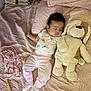 Abigail Ortuno joined the competition — help win amazing prizes! baby, sleeping, stuffed_animal, bed, pajamas, blanket, toy, child, soft_toys, cute, indoor, pink, quilt, cozy, socks, sleep, rest, infant, comfort, peaceful