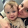 Miles joined the competition — help win amazing prizes! toddler, child, woman, face, smile, blue_eyes, indoor, selfie, dinosaur_pattern, clothing, person, skin, hair, hand, hoodie, window, towel, closeup, affection, family