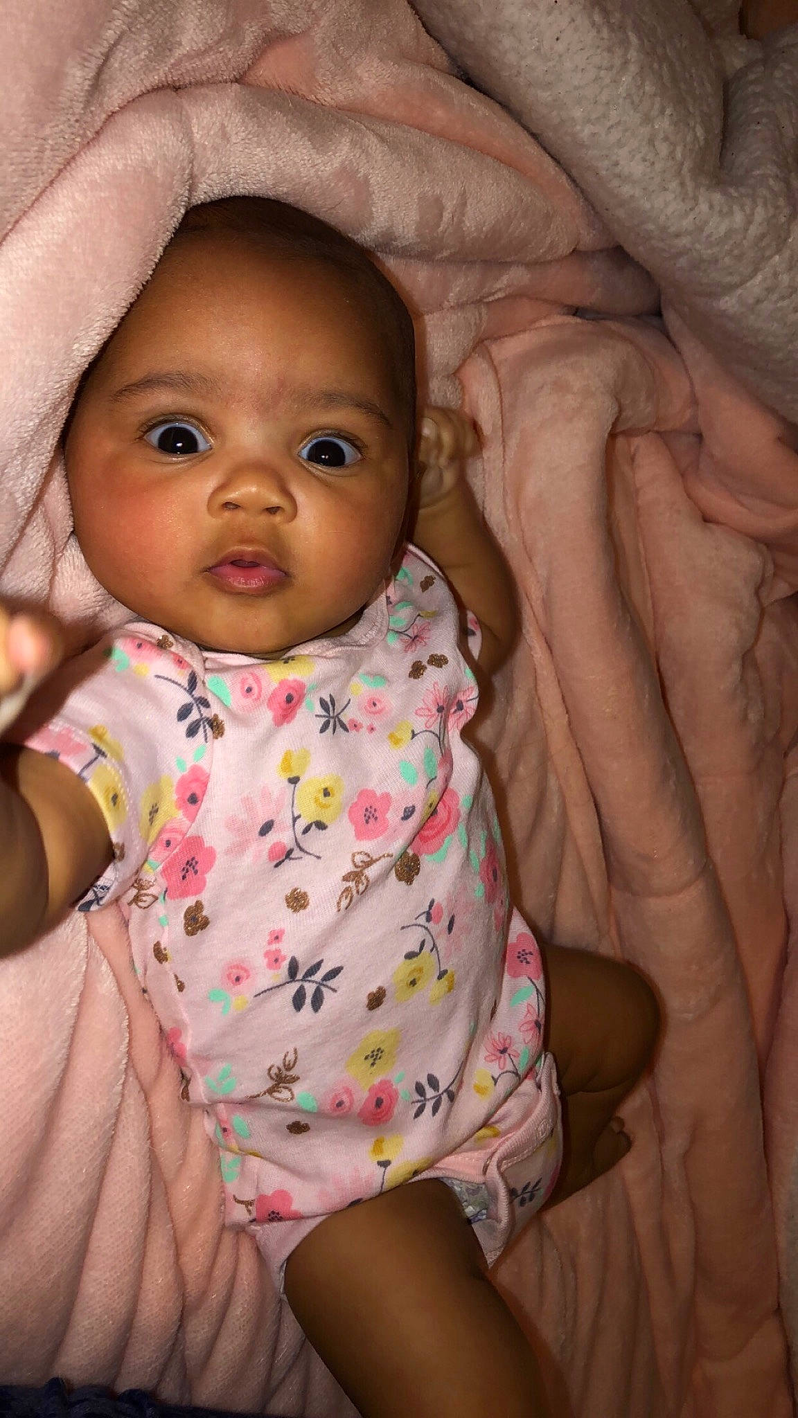 Gabriella is registered to the contest to win money with this photo: baby, baby_toddler_clothing, cheek, chin, dress, eyebrow, face, facial_expression, human, human_body, iris, lip, mouth, nose, organ, person, product, skin, sleeve, smile