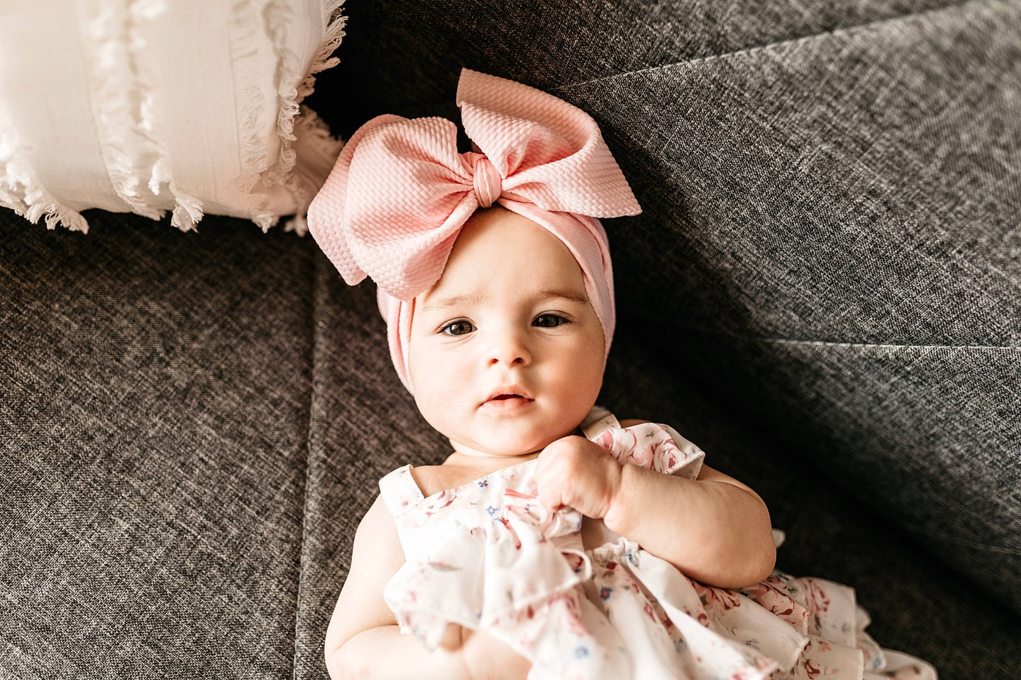 Landry joined the competition — help win amazing prizes! baby, baby_toddler_clothing, bridal_accessory, costume_hat, dress, embellishment, eyelash, happy, head, headband, headgear, headpiece, headwear, peach, person, petal, pink, skin, sleeve, textile