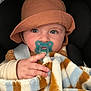 baby, pacifier, blanket, hat, blue_eyes, hand, striped_blanket, infant, clothing, cute, portrait, child, warm, cozy, closeup, car_seat, toddler, soft, expression, face