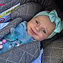 Mavie participe au concours pour gagner de l'argent avec cette photo : adorable, baby, blue_eyes, bow, car_seat, child, close_up, clothing, cute, fabric, floral_embroidery, headband, infant, pacifier, padded, person, portrait, safety, seat_belt, smile