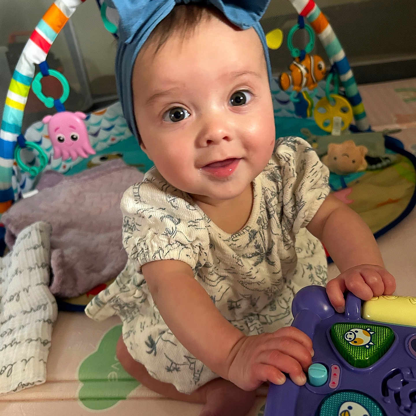 Piper joined the competition — help win amazing prizes! accessories, baby, bodypart, cap, clothing, couch, crawling, face, furniture, happy, hat, head, headband, person, photography, portrait, sitting, sleeve, smile, toy