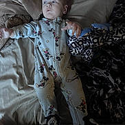 Jase Jr joined the competition — help win amazing prizes! baby, onesie, mickey_mouse, plush_toy, bed, blanket, sleepwear, infant, footed_pajamas, soft_toys, cute, child, person, indoors, resting, lying_down, comfort, mickey_mouse_footwear, expression, sleep