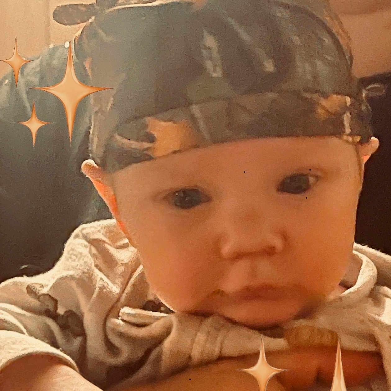 Jase Jr joined the competition — help win amazing prizes! adorable, antlers, baby, camo, child, closeup, cute, expression, face, hand, headband, heart_emoji, holding, indoors, infant, person, portrait, soft_focus, sparkles, warm_light