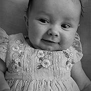 Mabel joined the competition — help win amazing prizes! baby, child, smiling, portrait, black_and_white, dress, embroidered, cute, infant, face, hand, soft, texture, young, person, clothing, happy, lying_down, closeup, expression