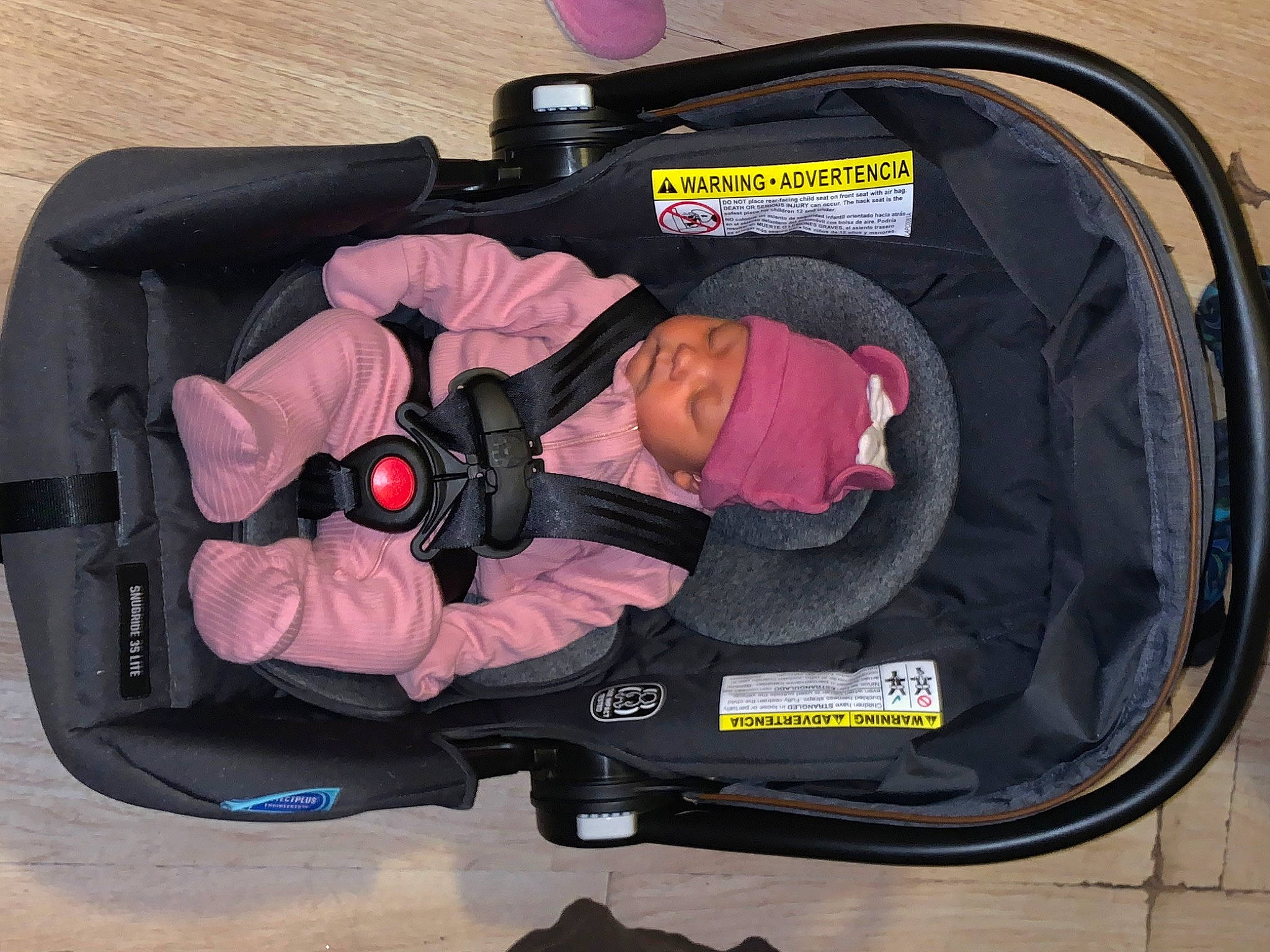 Evelyn is registered to the contest to win money with this photo: auto_part, baby, baby_carriage, baby_products, baby_safety, baby_toddler_clothing, bag, baggage, car_seat, child, comfort, headwear, luggage_and_bags, person, personal_protective_equipment, product, sitting, toddler, travel