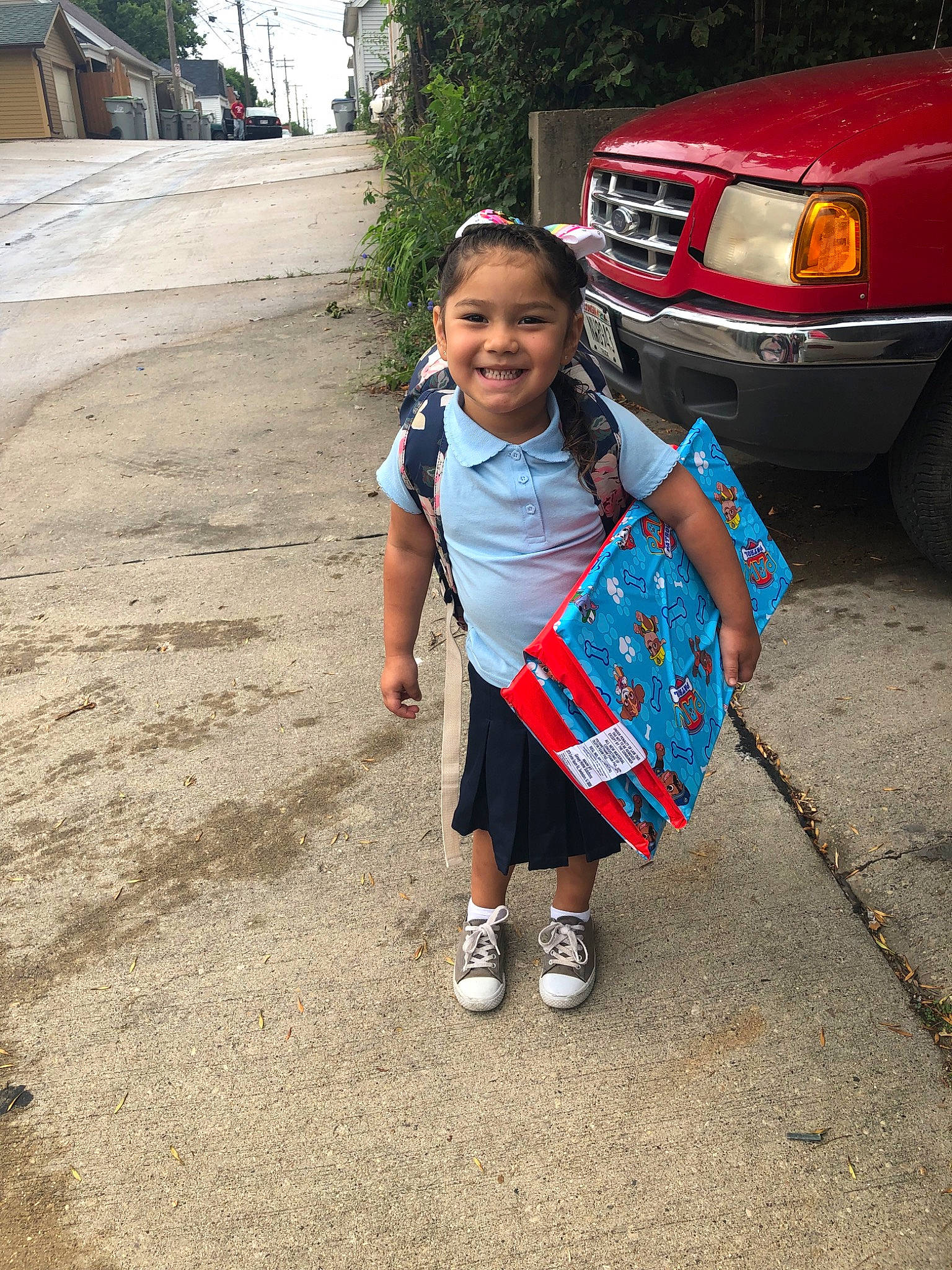 Leilani is registered to the contest to win money with this photo: asphalt, auto_part, car, child, family_car, joy, luxury_vehicle, minivan, neighbourhood, people, person, shoe, smile, summer, t_shirt, toddler, tourism, travel, tree, vacation