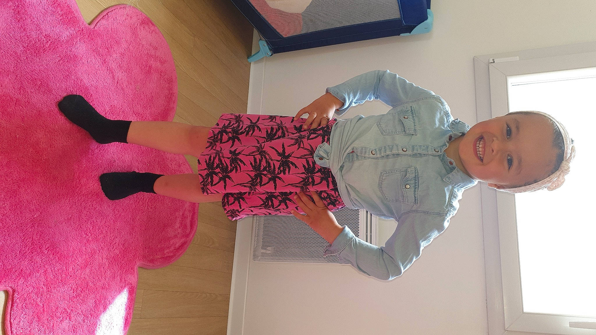 Calie participe au concours pour gagner de l'argent avec cette photo : carmine, comfort, dress, elbow, finger, human_leg, joint, joy, knee, leg, magenta, pattern, person, pink, plant, room, sleeve, smile, standing, textile