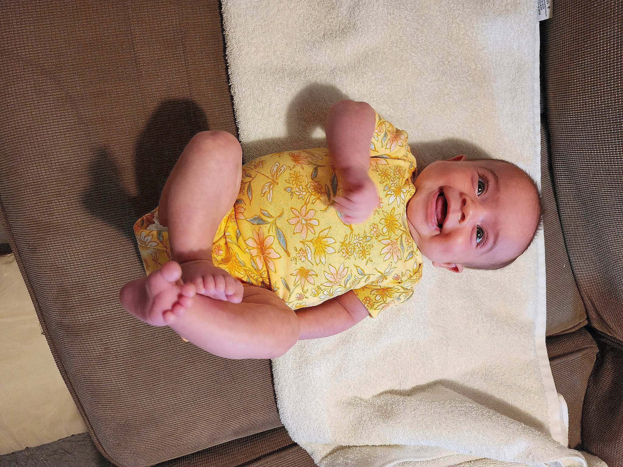 Alanna is registered to the contest to win money with this photo: baby, baby_products, baby_safety, baby_toddler_clothing, cheek, child, comfort, dress, finger, foot, hand, infant_bed, linens, pattern, person, pink, room, skin, smile, textile