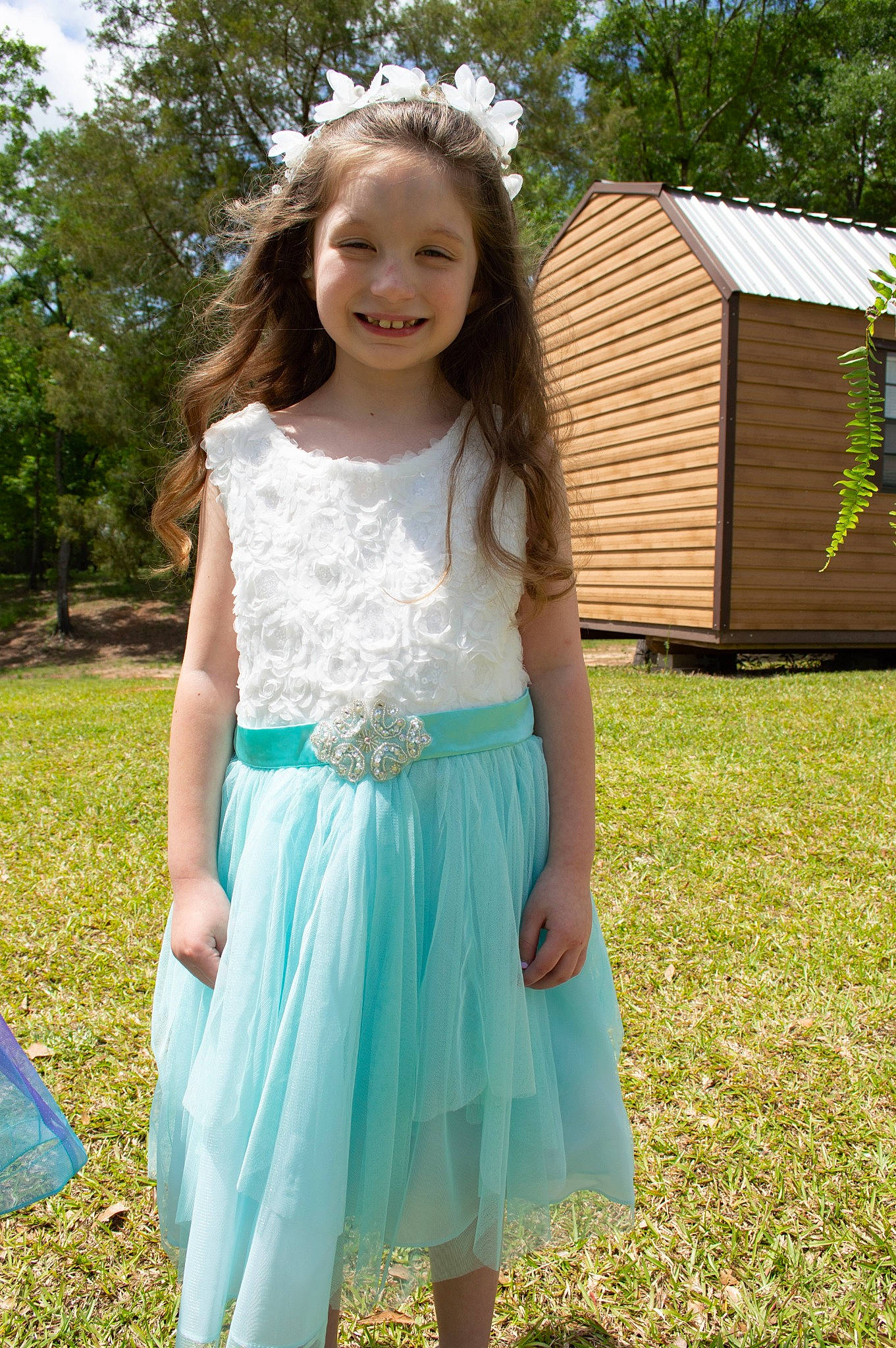 Hannah is registered to the contest to win money with this photo: baby_toddler_clothing, day_dress, dress, eye, formal_wear, grass, hair, happy, joy, long_hair, outerwear, people_in_nature, person, plant, shoulder, sleeve, smile, t_shirt, toddler, tree