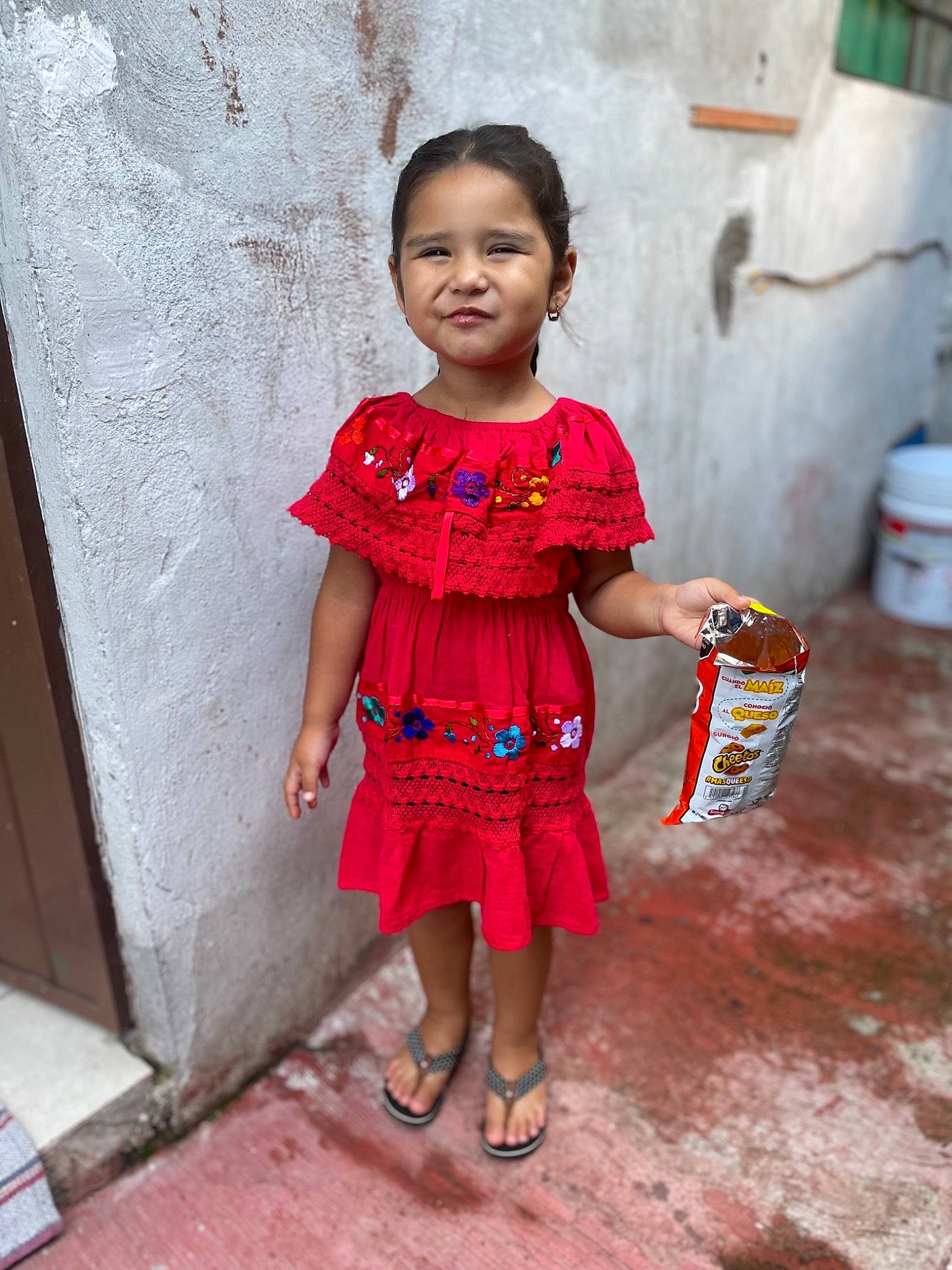 Stephanie is registered to the contest to win money with this photo: baby_toddler_clothing, child, day_dress, dress, face, fashion_design, fun, happy, human_leg, magenta, people, person, pink, sandal, sitting, skin, sleeve, standing, street_fashion, toddler