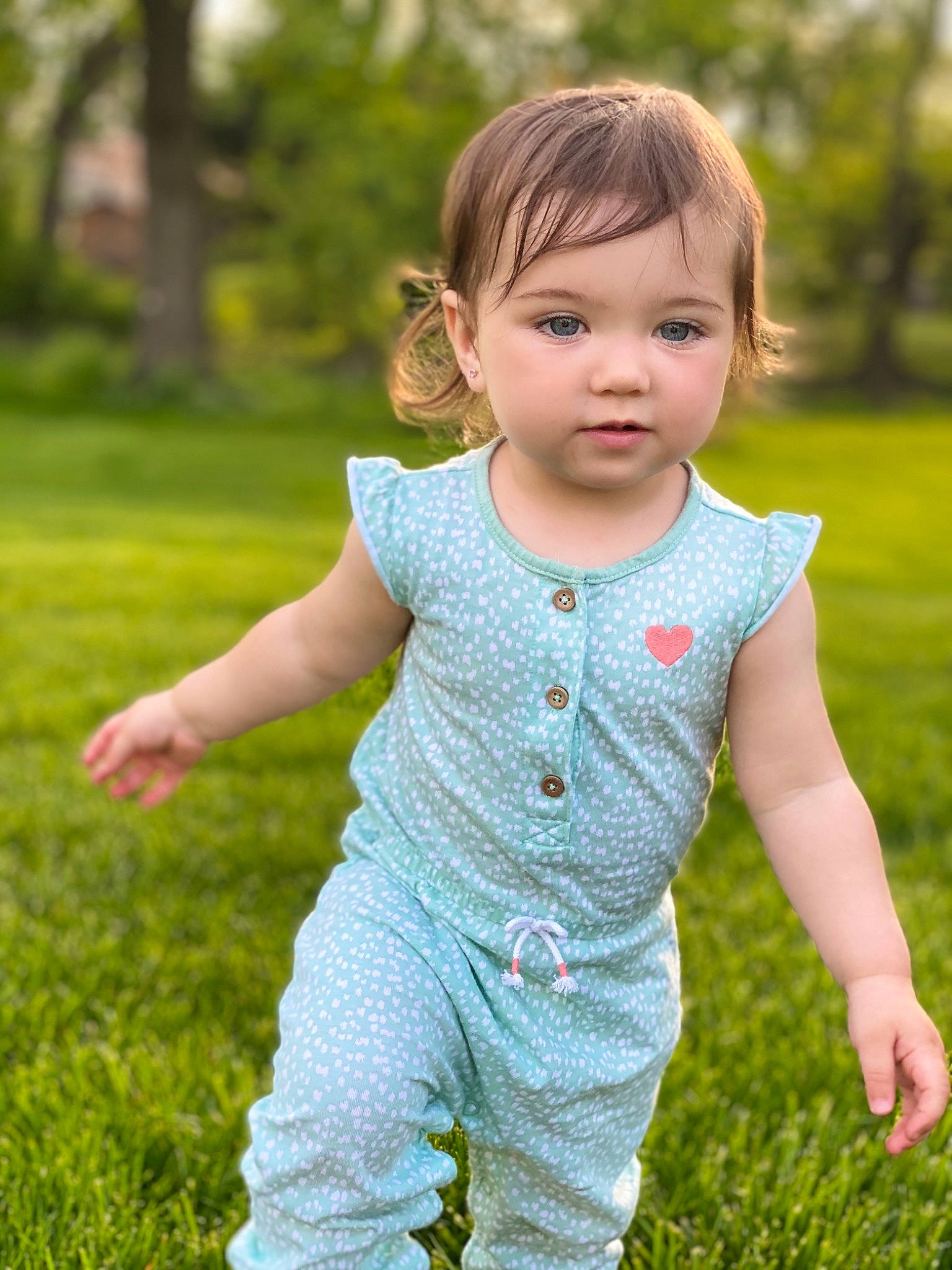 Leighla is registered to the contest to win money with this photo: baby, baby_toddler_clothing, botany, child, fun, gesture, grass, grass_family, grassland, happy, leaf, meadow, people_in_nature, person, plant, skin, sleeve, t_shirt, toddler, tree