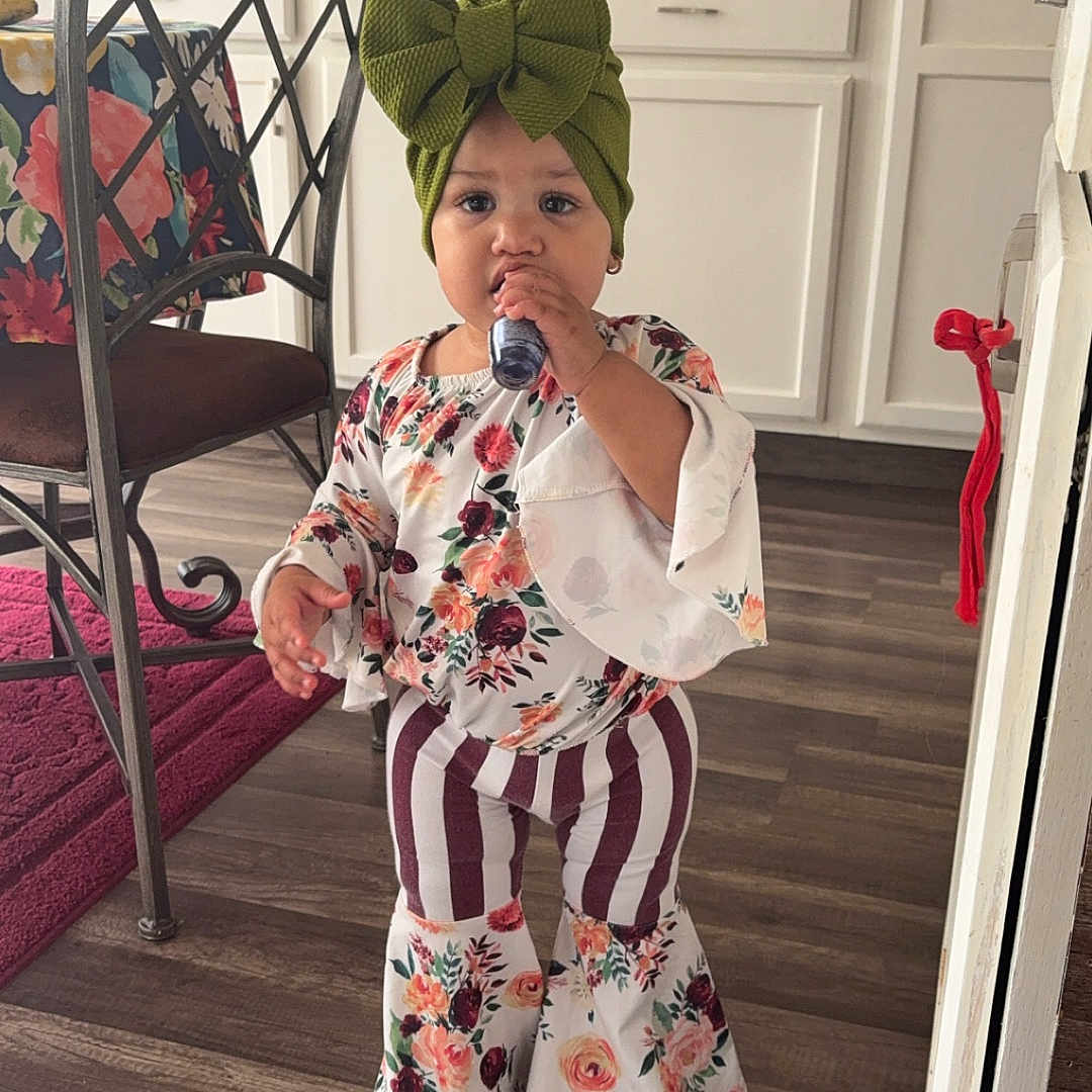 Xenia is registered to the contest to win money with this photo: adult, clothing, cutlery, diningtable, face, female, furniture, hardwood, hat, head, indoors, interiordesign, pants, person, photography, portrait, spoon, table, woman, wood