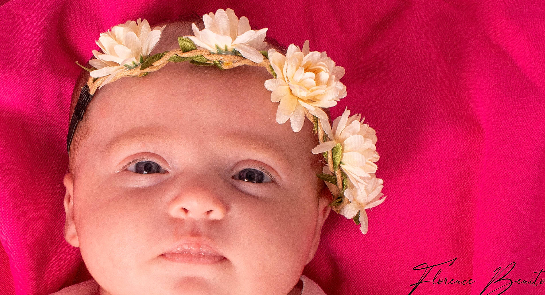Naëlle participe au concours pour gagner de l'argent avec cette photo : baby, cheek, child, crown, fashion_accessory, flower, hair_accessory, head, headband, headgear, headpiece, person, petal, pink, plant, toddler