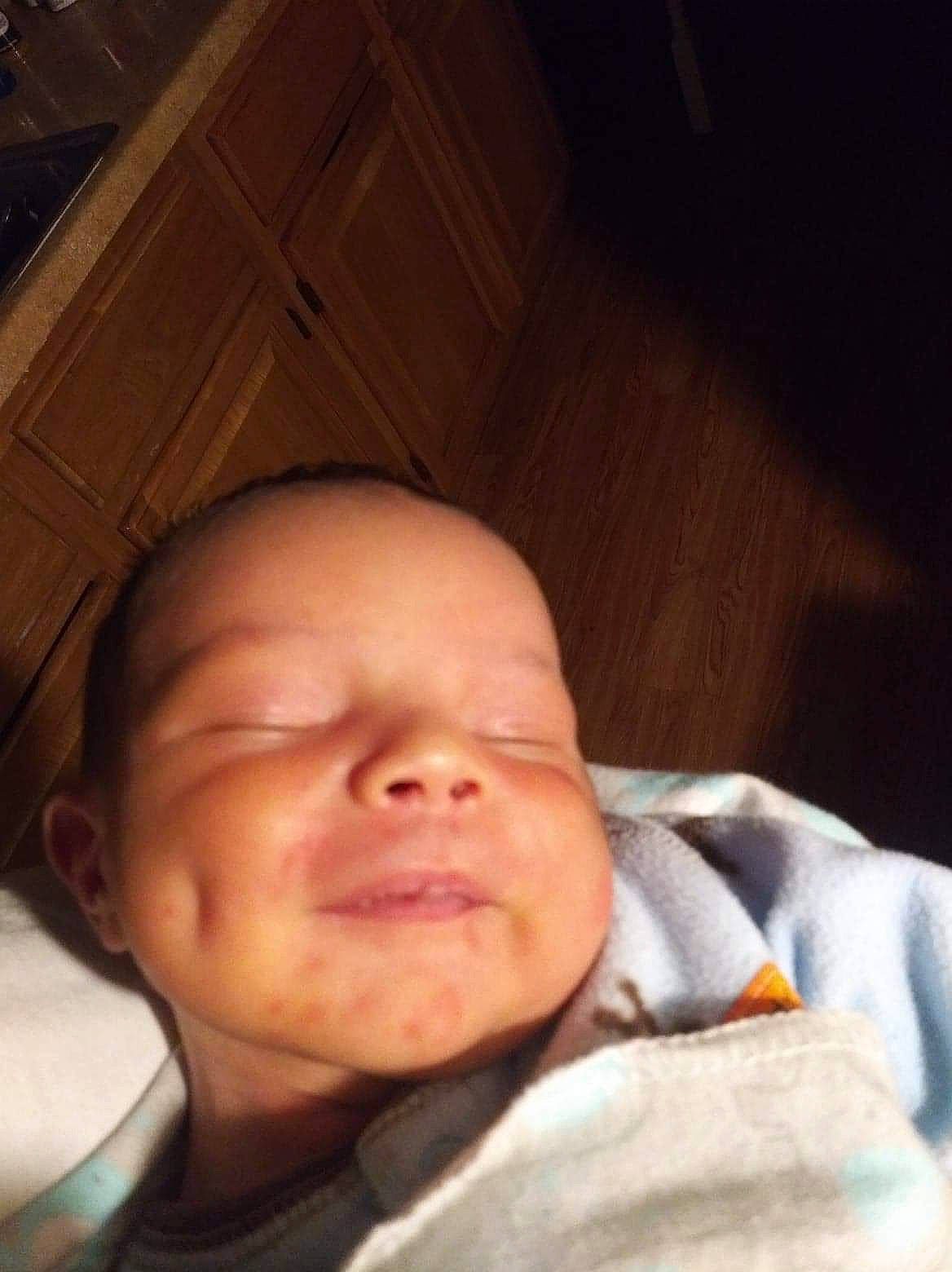 Azekiel is registered to the contest to win money with this photo: baby, baby_toddler_clothing, bedtime, cheek, child, chin, comfort, ear, eyebrow, facial_expression, happy, head, lip, mouth, nose, person, skin, smile, thumb, toddler