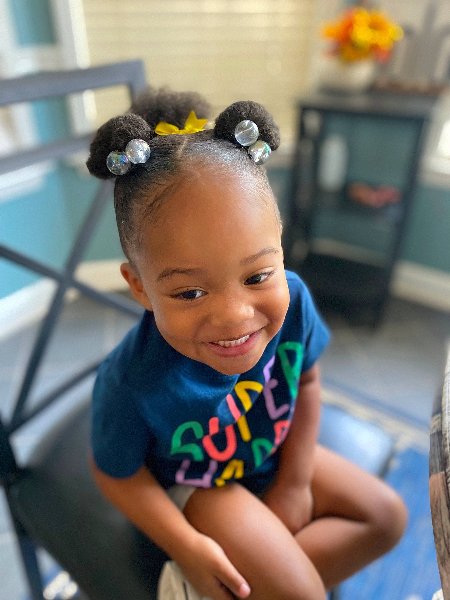 Karlei is registered to the contest to win money with this photo: arm, audio_equipment, baby, baby_toddler_clothing, child, cool, electric_blue, face, fun, happy, joy, knee, leisure, organ, person, personal_protective_equipment, recreation, sitting, skin, smile