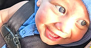 Jedidiah is registered to the contest to win money with this photo: arm, baby, blue_hoodie, car_safety, car_seat, child, closeup, clothing, cute, eyes, face, happy, heart_shape, infant, portrait, safety_belt, seatbelt, smiling, sunlight, warning_label