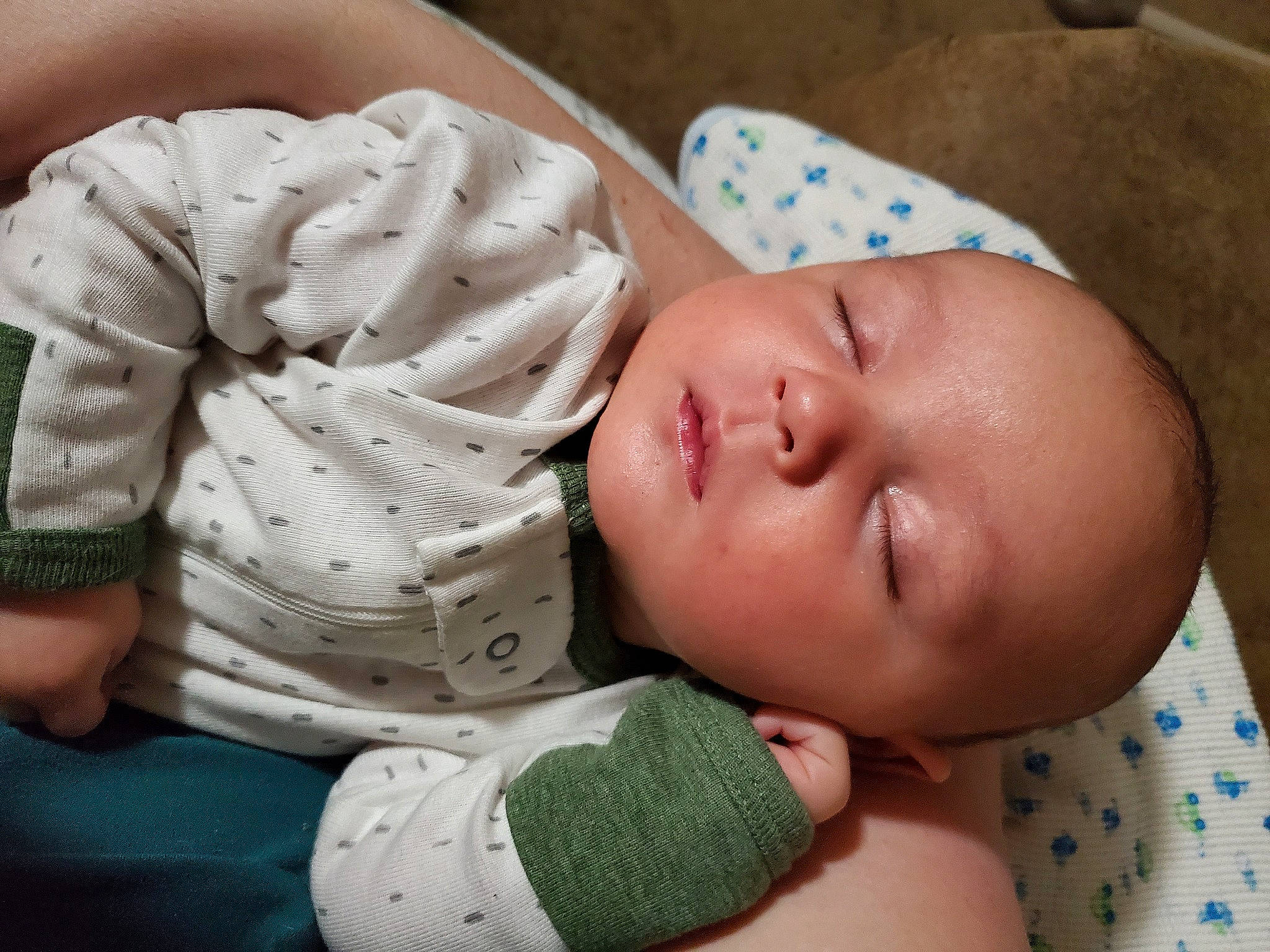 Lucian is registered to the contest to win money with this photo: baby, baby_products, baby_sleeping, baby_toddler_clothing, bedtime, cheek, child, chin, comfort, facial_expression, finger, hand, human_body, linens, mouth, nail, nose, person, skin, thumb