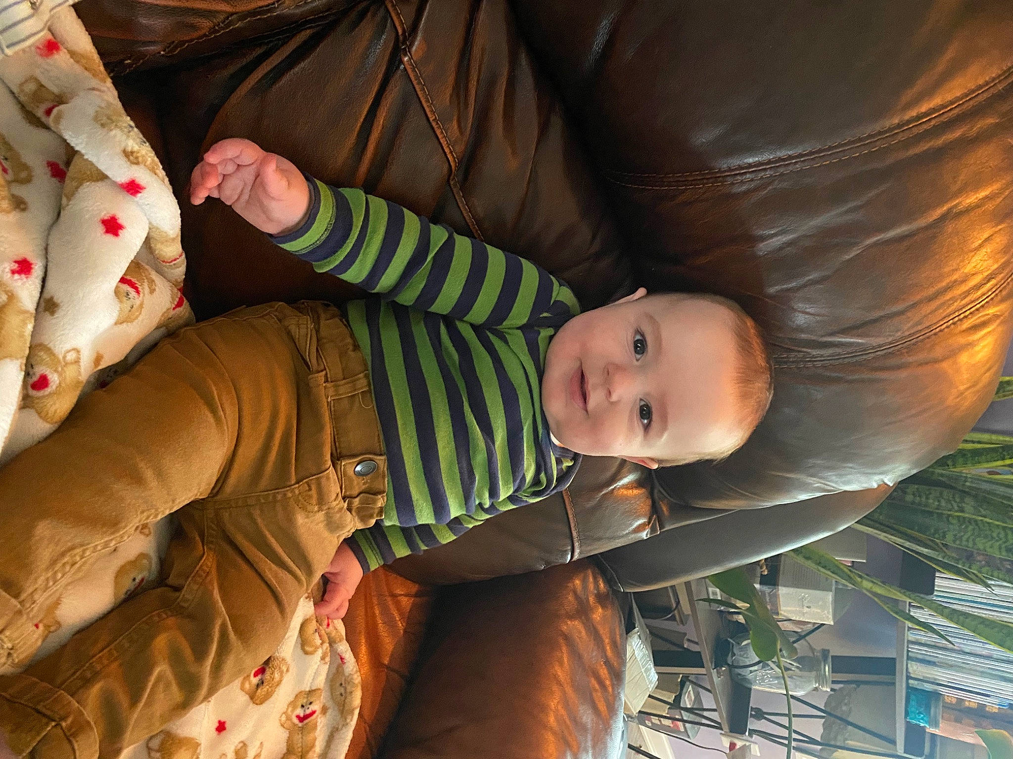 Myles is registered to the contest to win money with this photo: baby, baby_toddler_clothing, beauty, cheek, child, comfort, elbow, facial_expression, human_leg, joy, mammal, pattern, people, person, sitting, skin, sleeve, textile, thigh, toddler