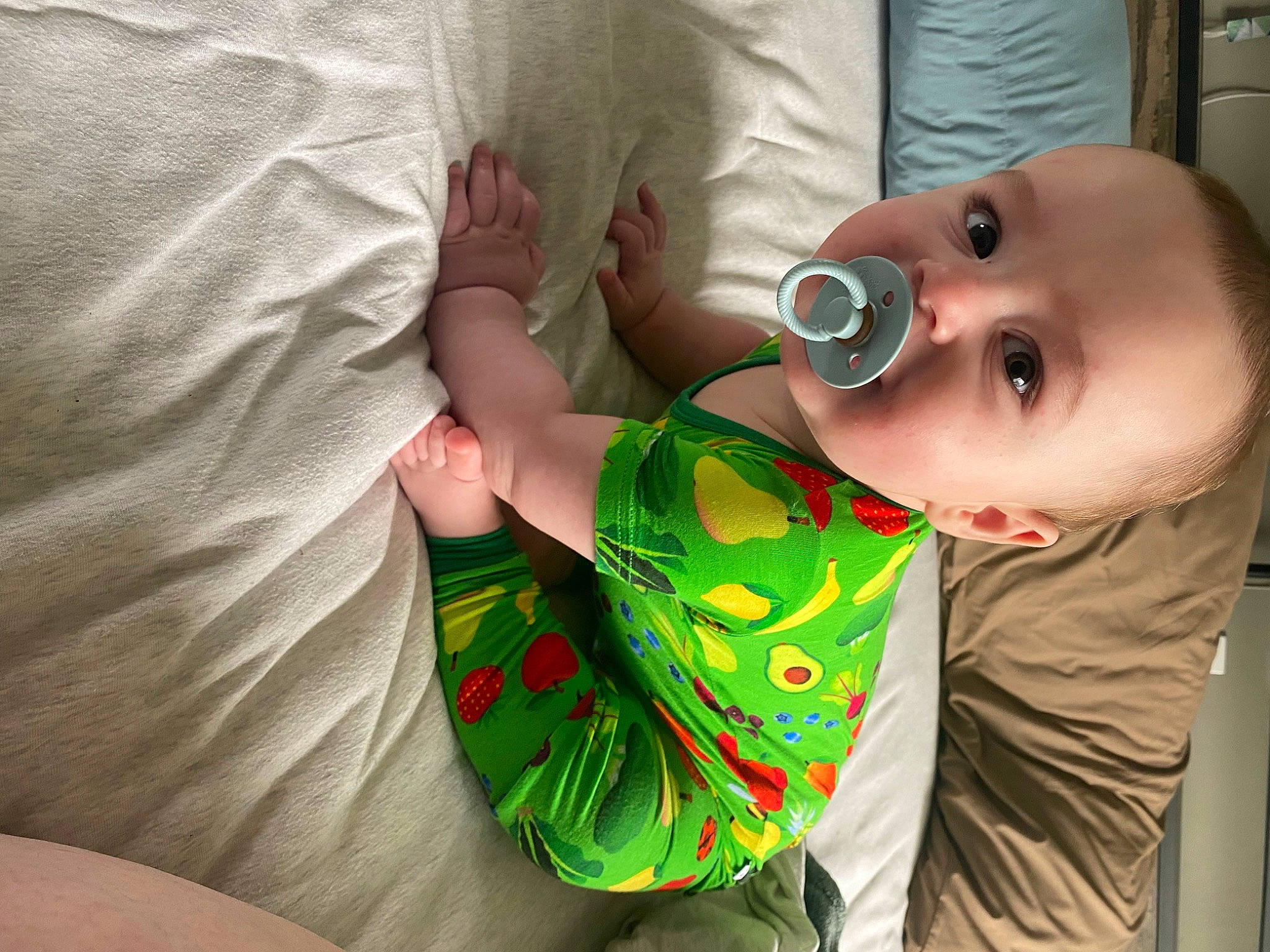 Myles is registered to the contest to win money with this photo: baby, baby_toddler_clothing, cheek, child, comfort, finger, gesture, happy, human_body, iris, lip, mammal, mouth, neck, nose, person, skin, sleeve, textile, toddler