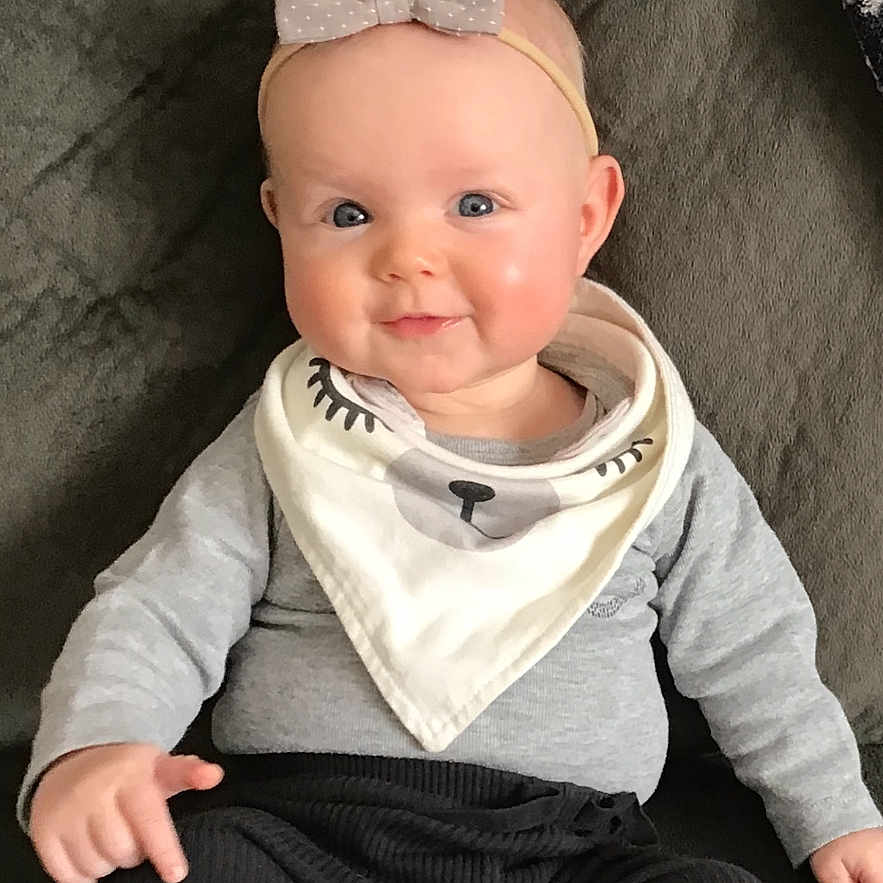 Ellie joined the competition — help win amazing prizes! baby, bodypart, clothing, couch, cushion, face, finger, furniture, hand, happy, hat, head, homedecor, newborn, pants, person, photography, portrait, sitting, smile